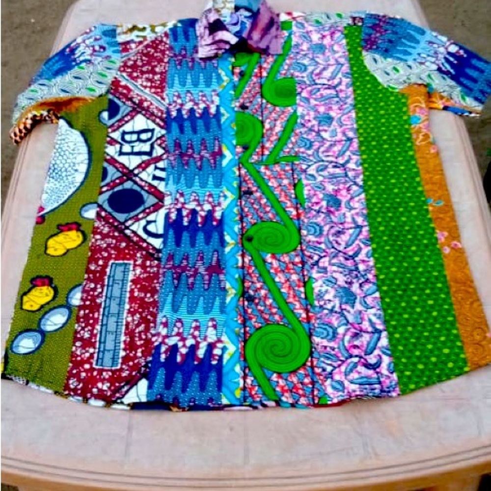 These shirts are made by Didier Adjewodo of Togo, West Africa.